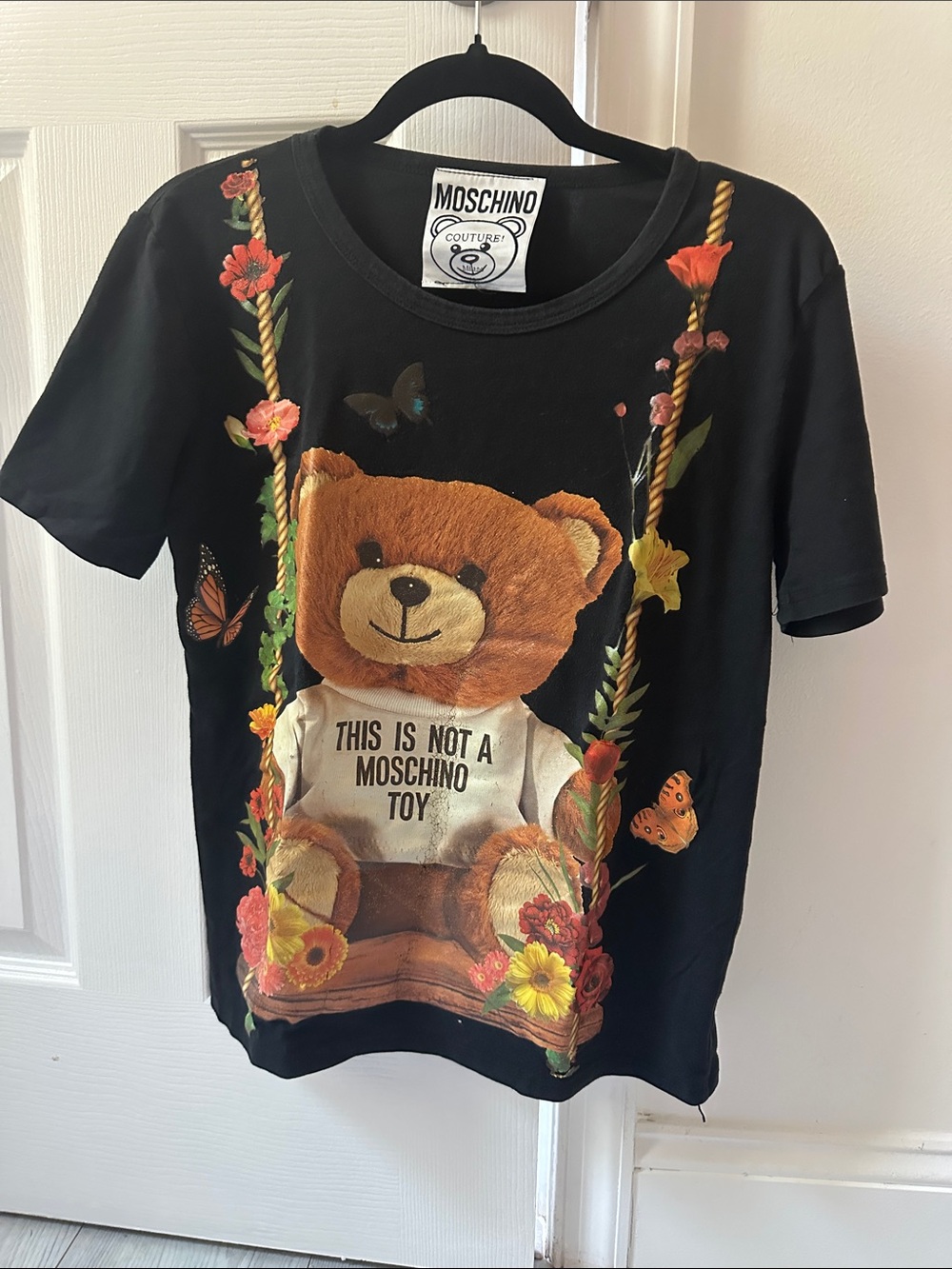 Moschino Black Tee with Brown Teddy and Floral Graphic